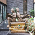 Garden metal figure bronze boy and girl reading book sculpture